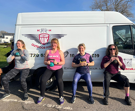 Bournemouth bootcamp members exercising with kettlebells
